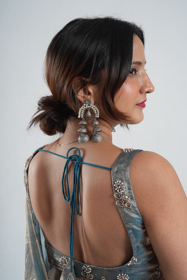 glossy slate-blue and gold-shimmer metallic saree