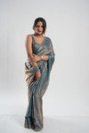 glossy slate-blue and gold-shimmer metallic saree