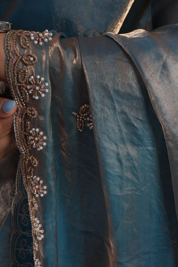 glossy slate-blue and gold-shimmer metallic saree